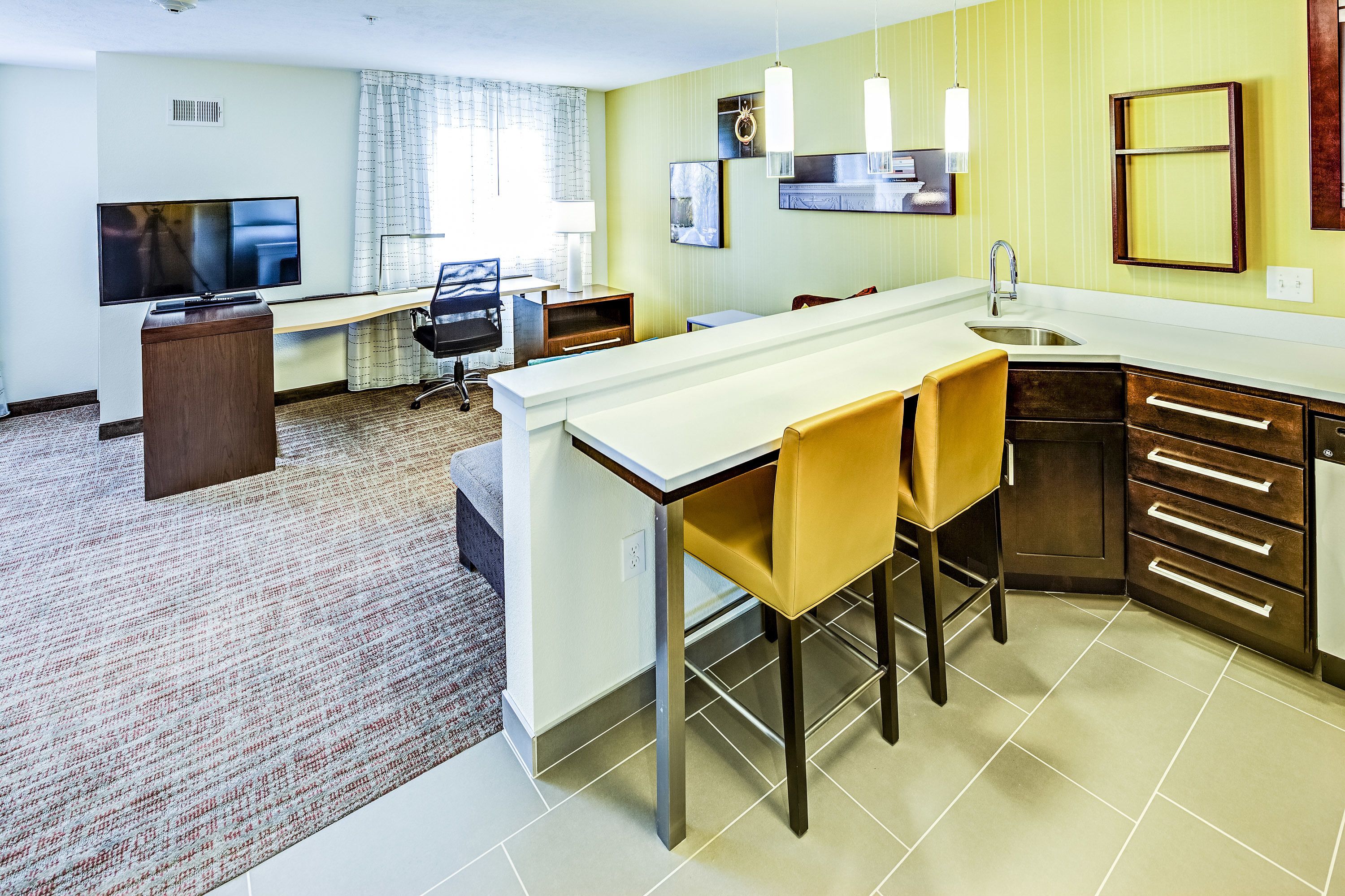 hypo-allergenic bedding, desk, laptop workspace, blackout curtains