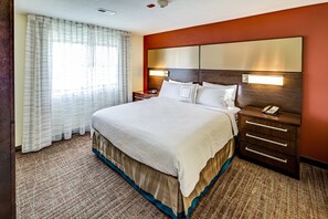 Hypo-allergenic bedding, desk, laptop workspace, blackout drapes