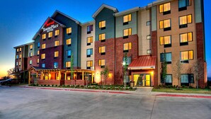 A multi-story hotel with a prominent sign for 'Marriott TownePlace Suites'.