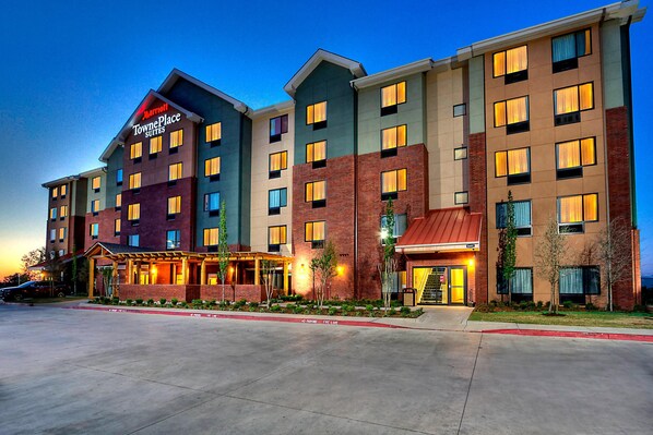A multi-story hotel with a prominent sign for 'Marriott TownePlace Suites'.