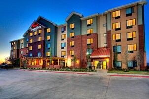 A multi-story hotel with a prominent sign for 'Marriott TownePlace Suites'.