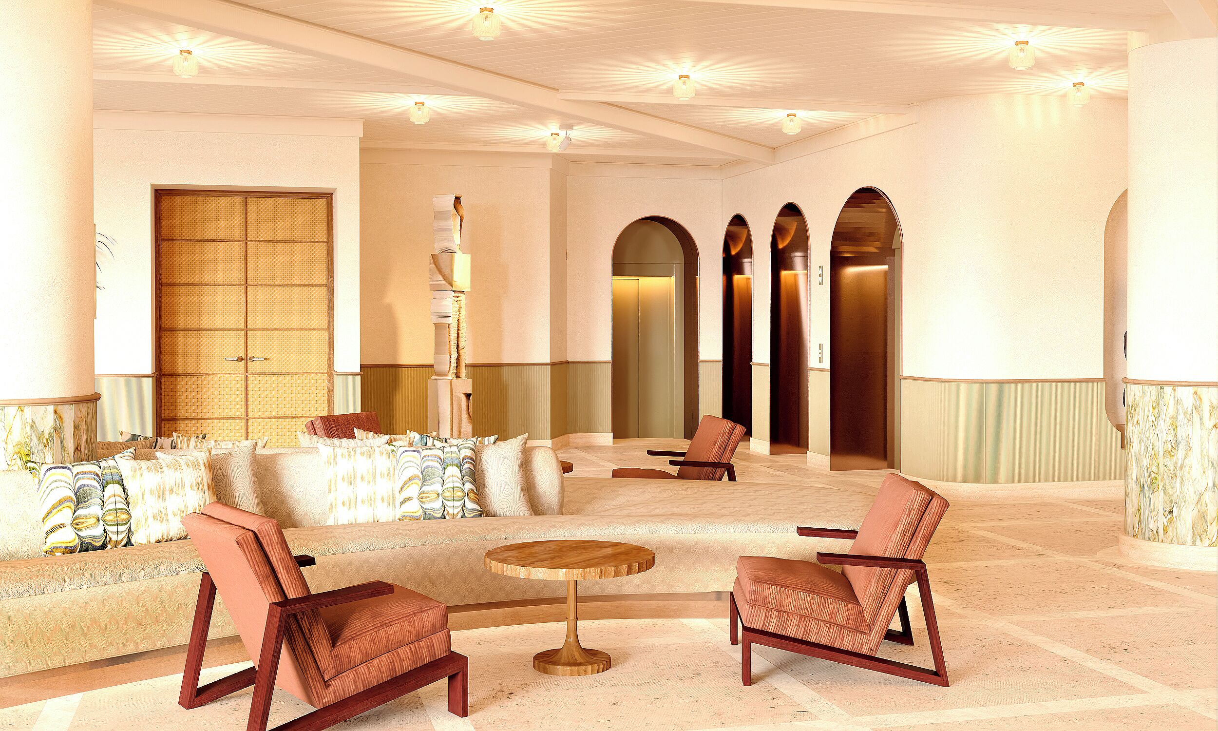 A spacious lobby with a sofa, two armchairs, a round table, and a decorative column.