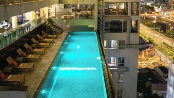 Outdoor pool, open 7:00 AM to 7:00 PM, pool umbrellas, sun loungers
