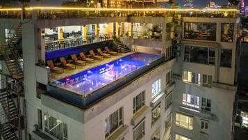 Outdoor pool, open 6:00 AM to 10:30 PM, pool loungers