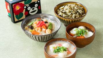 A table with three bowls of food and a decorative box.