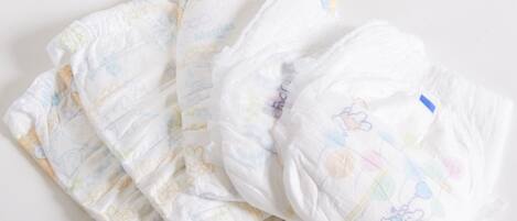 A collection of baby diapers with cartoon characters.