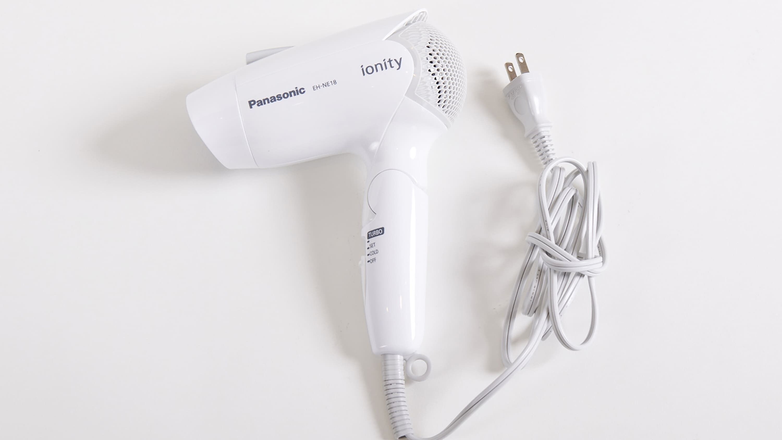A Panasonic ionity hair dryer with a power cord.