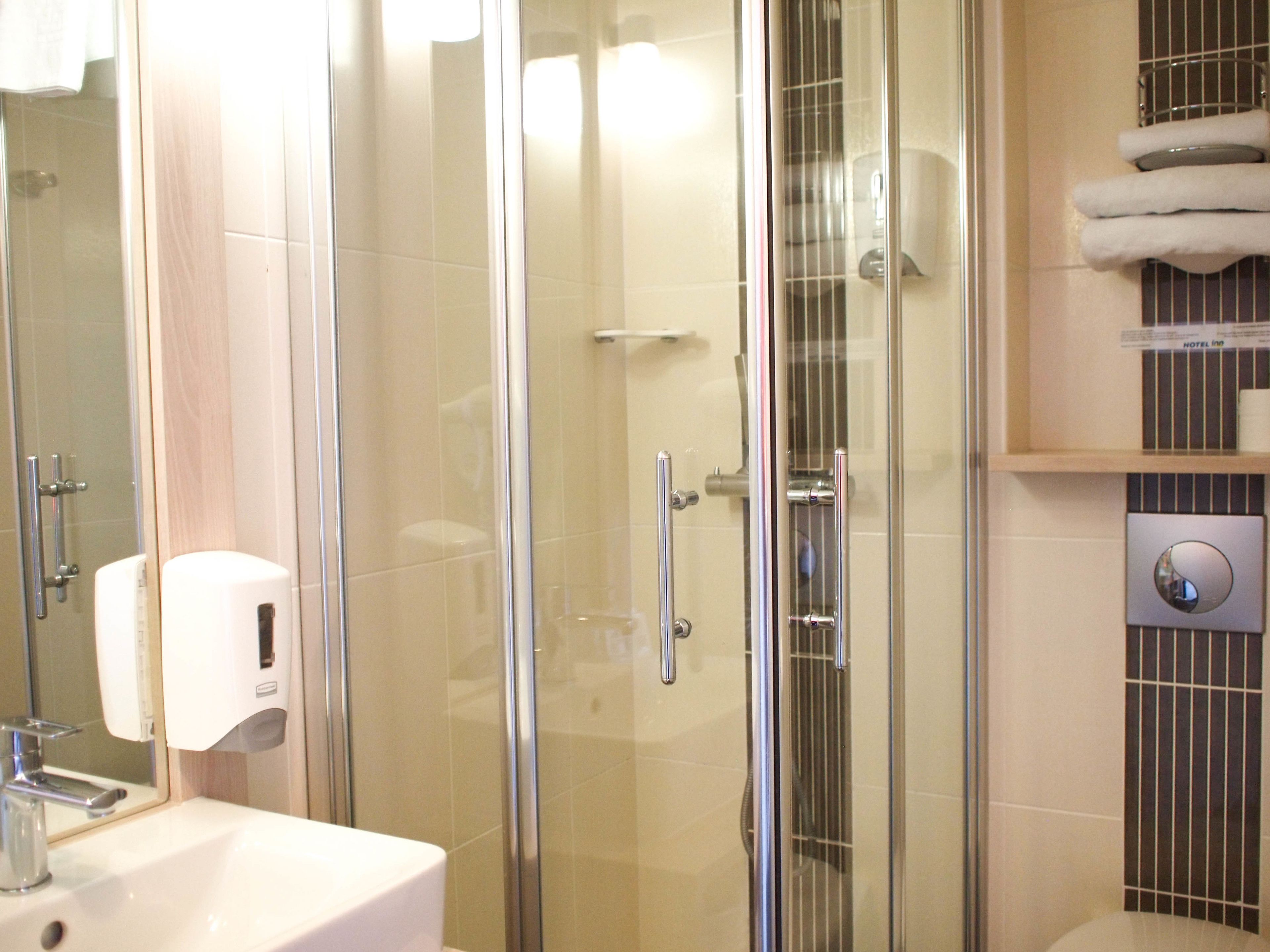 shower, free toiletries, hair dryer, towels