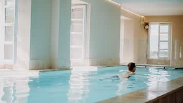 Indoor pool, open 9:30 AM to 8:00 PM, pool loungers