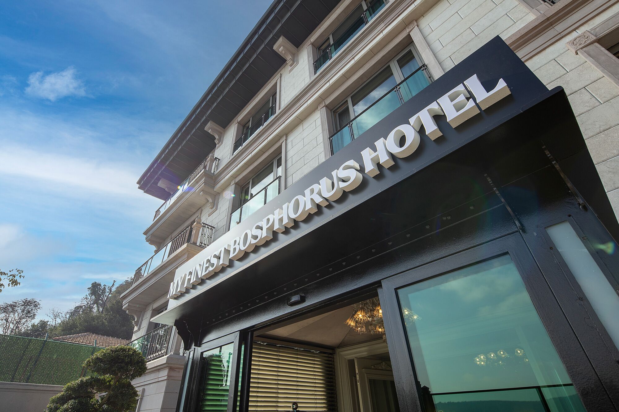 The exterior of the My First Bosphorus Hotel with a prominent sign and a modern facade.