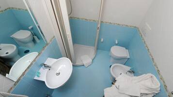 Shower, free toiletries, hair dryer, slippers