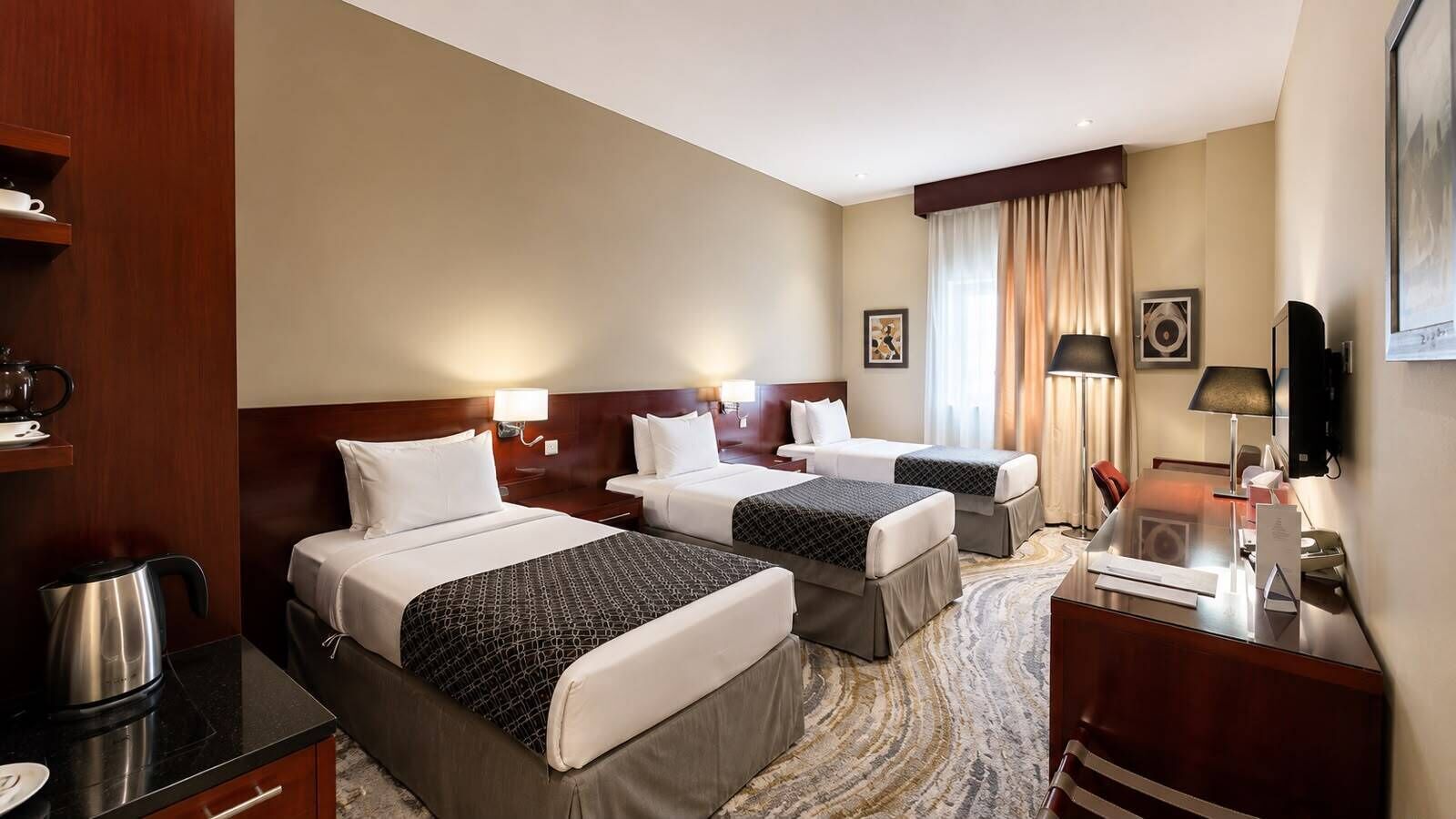 Standard Triple Room | Minibar, in-room safe, desk, laptop workspace