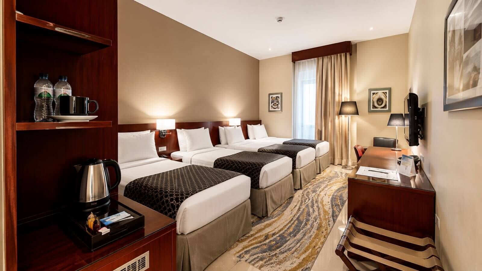 Standard Quadruple Room | Minibar, in-room safe, desk, laptop workspace