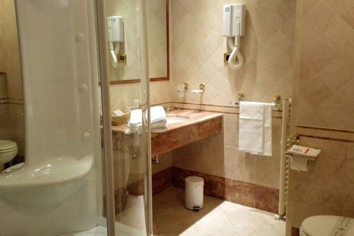 bathtub, jetted bath, hair dryer, slippers