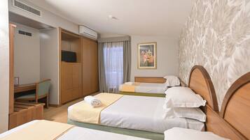 Triple Room | Minibar, in-room safe, desk, laptop workspace