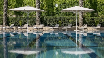 Seasonal outdoor pool, pool umbrellas, pool loungers