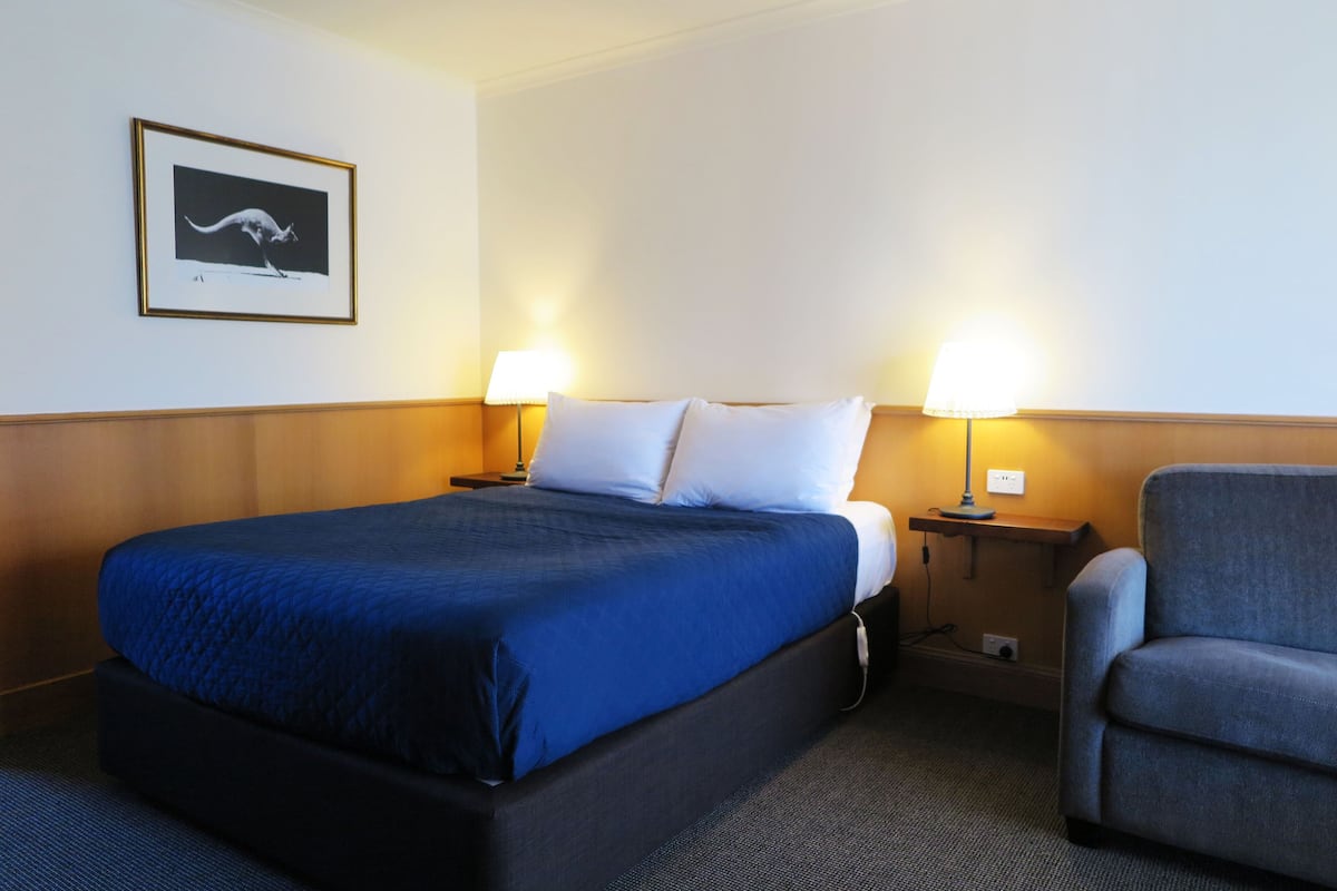 Upstairs Economy Queen Room | 1 bedroom, desk, laptop workspace, iron/ironing board