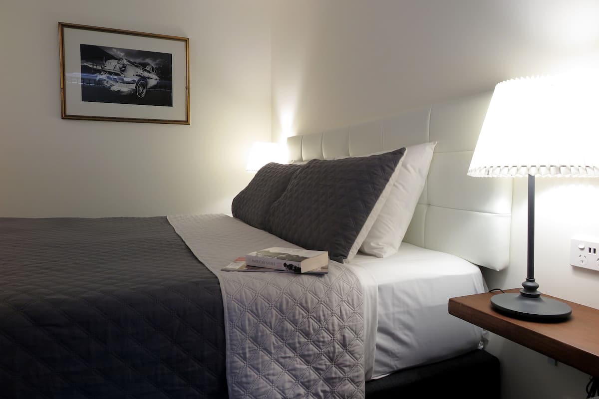 Premium Room, 1 King Bed, Kitchenette | 1 bedroom, desk, laptop workspace, iron/ironing board