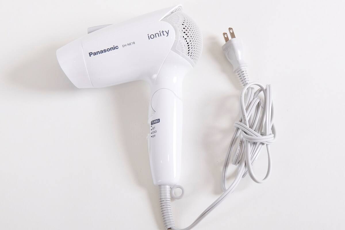 A Panasonic ionity hair dryer with a power cord.