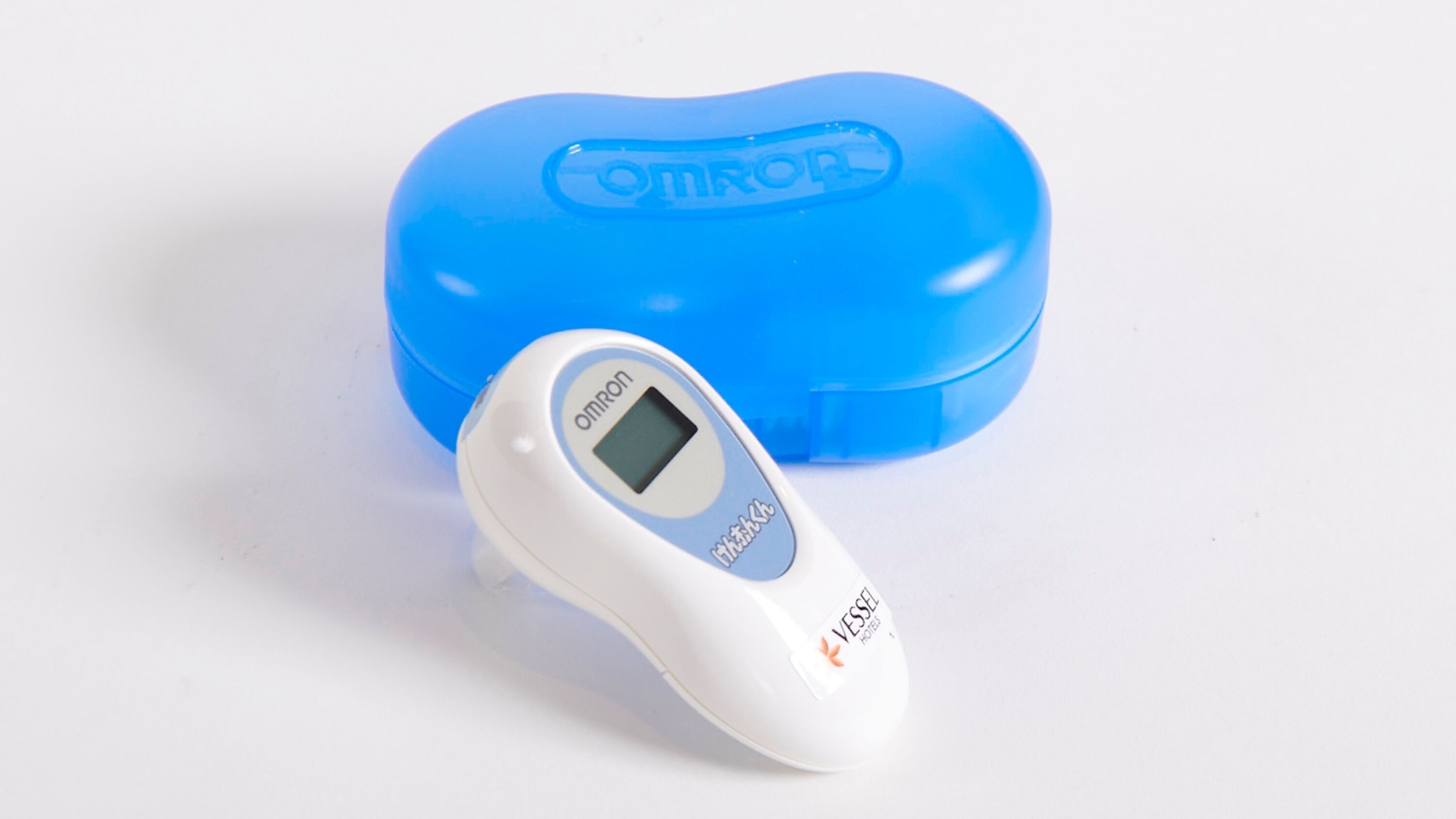 A white digital thermometer with a blue case.