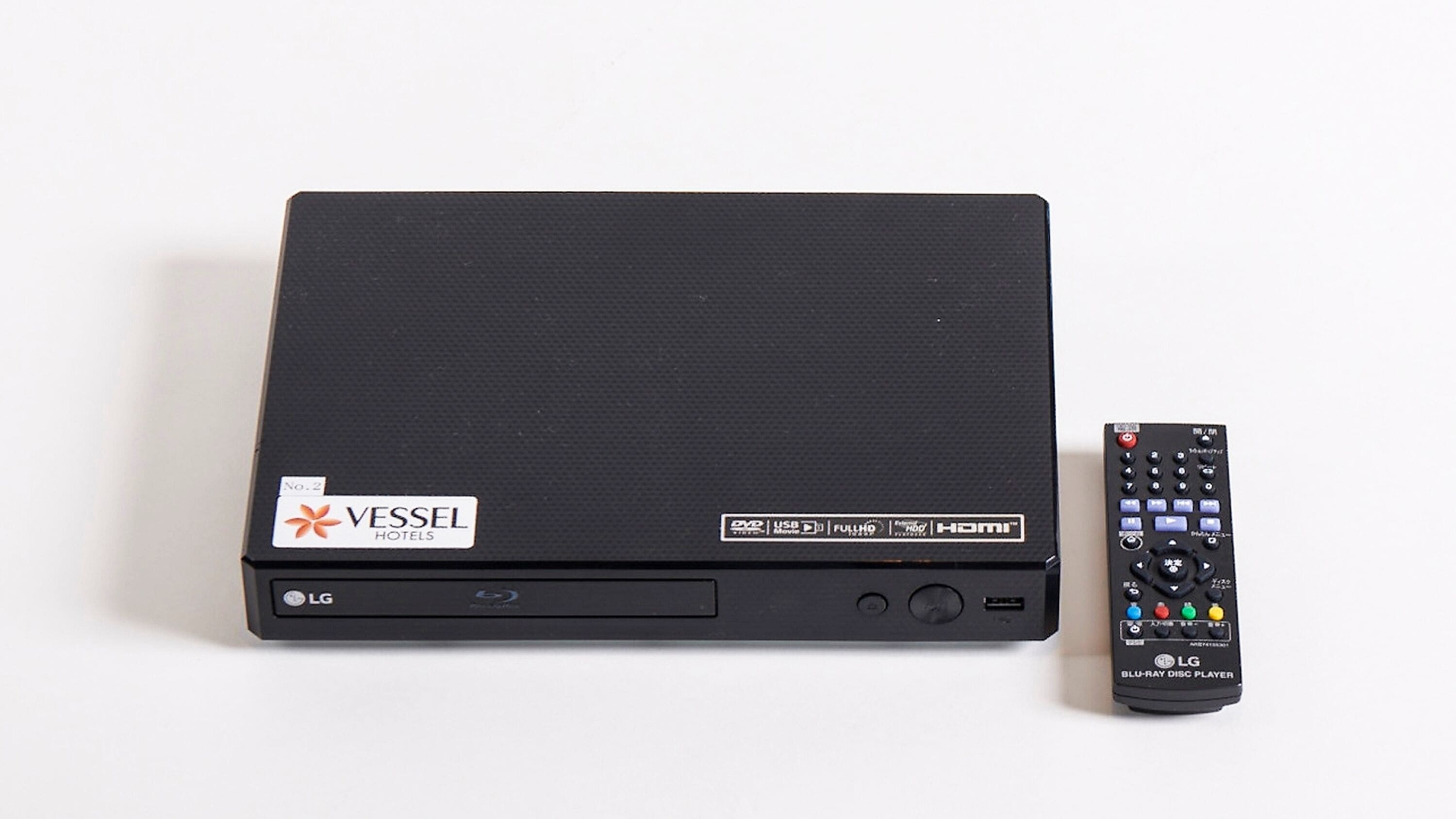 A black LG Blu-ray Disc Player with a remote control.