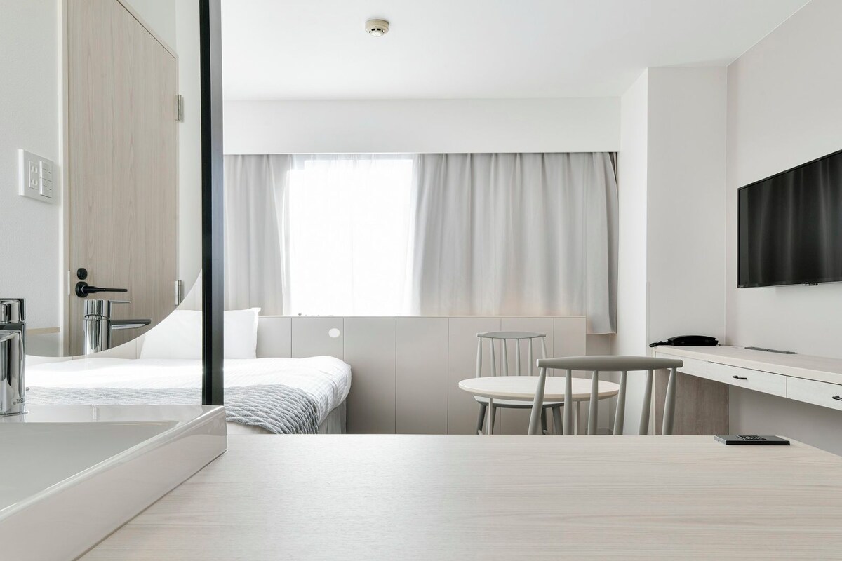 Desk, blackout drapes, iron/ironing board (on request), WiFi (free)