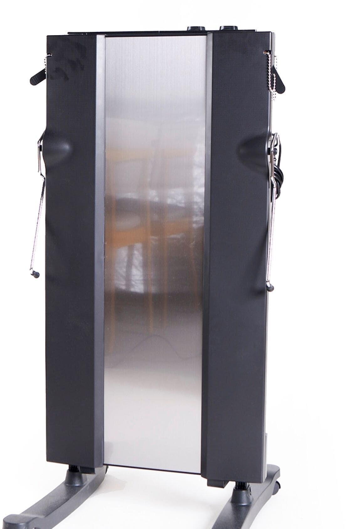 A stationary exercise machine with a metallic frame and black panels, featuring adjustable straps and a reflective surface.