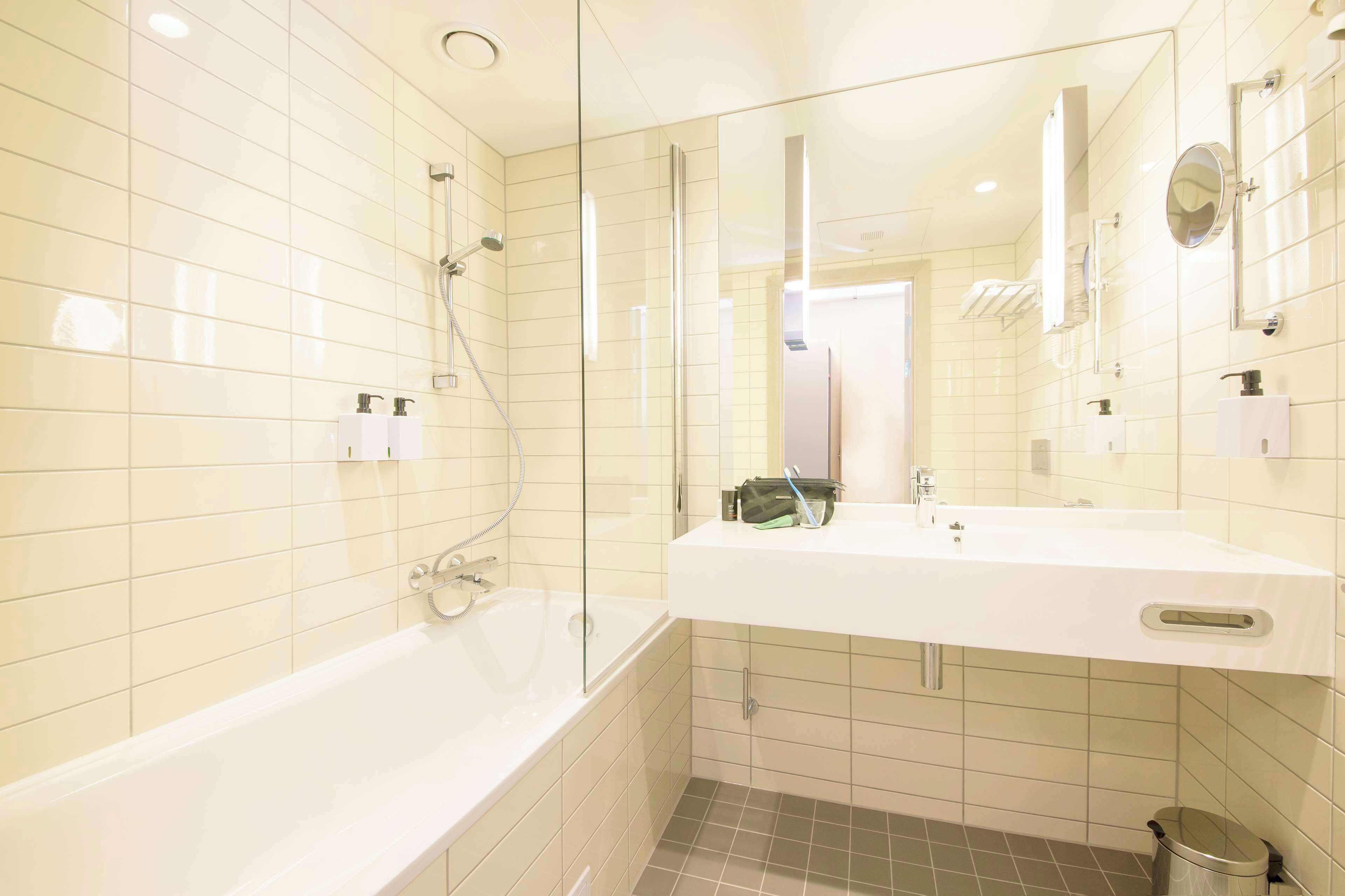 superior twin room | bathroom | designer toiletries, hair dryer, towels