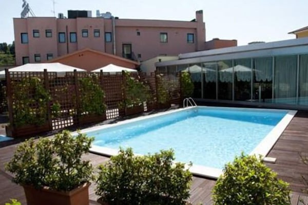 Seasonal outdoor pool, open 8:30 AM to 7:00 PM, pool umbrellas