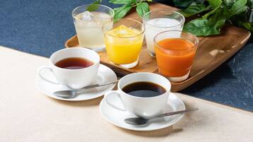 A breakfast tray with two cups of coffee, a glass of orange juice, and a glass of orange juice with ice cubes.