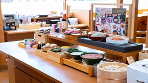 A buffet setup with various food items and condiments. - Vessel Inn Fukuyama Station (Fukuyama)