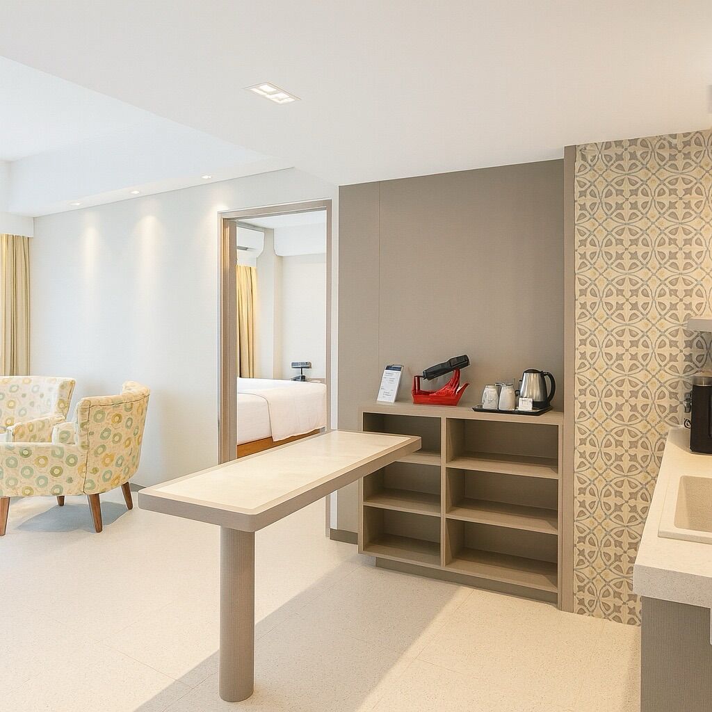 A hotel room with a bed, a desk, a chair, a shelf with toiletries, and a patterned wall.
