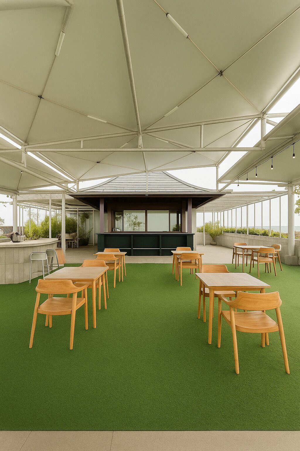 An outdoor dining area with tables and chairs, a bar, and a covered seating area.