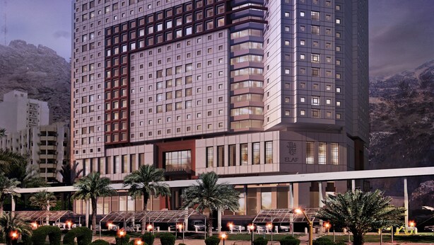 A modern high-rise hotel with a grid-like facade, multiple balconies, and a prominent rooftop feature. - Elaf Bakkah Hotel (Makkah)