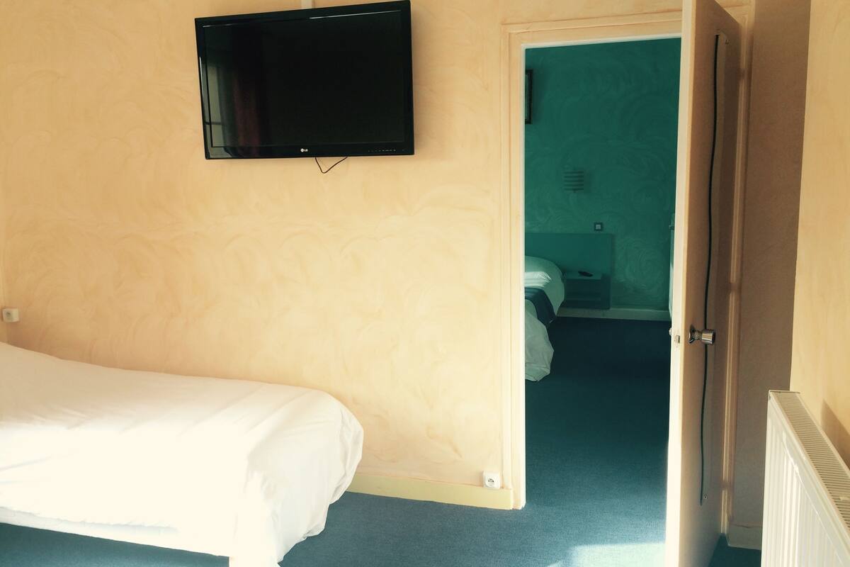 Premium bedding, desk, laptop workspace, soundproofing