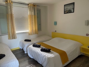Quadruple Room | Premium bedding, desk, laptop workspace, soundproofing