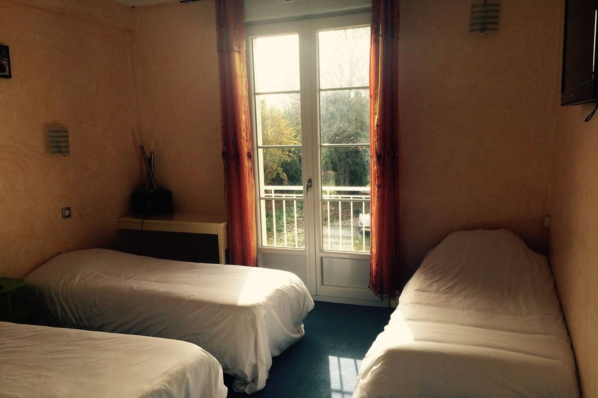 Premium bedding, desk, laptop workspace, soundproofing