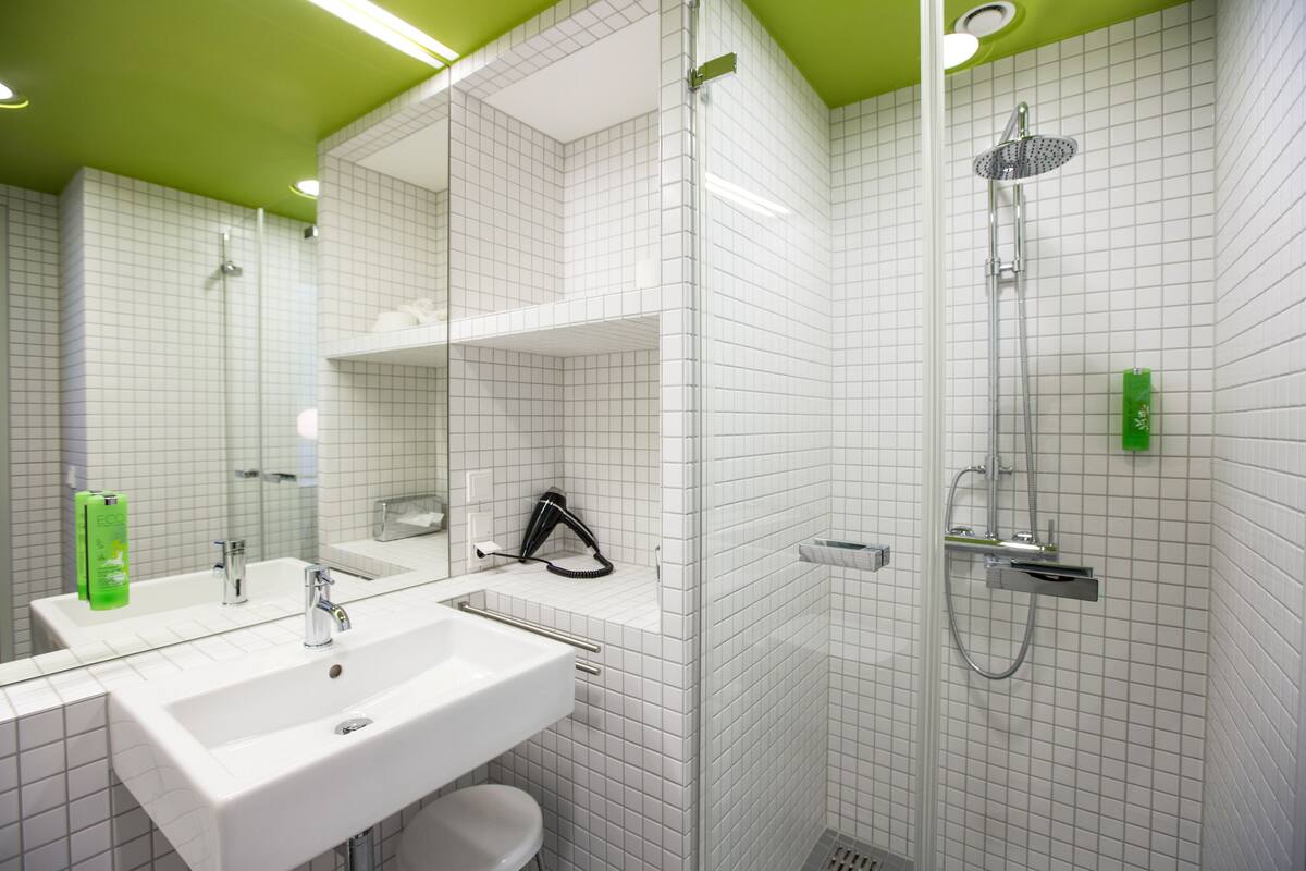 shower, rainfall showerhead, hair dryer, towels