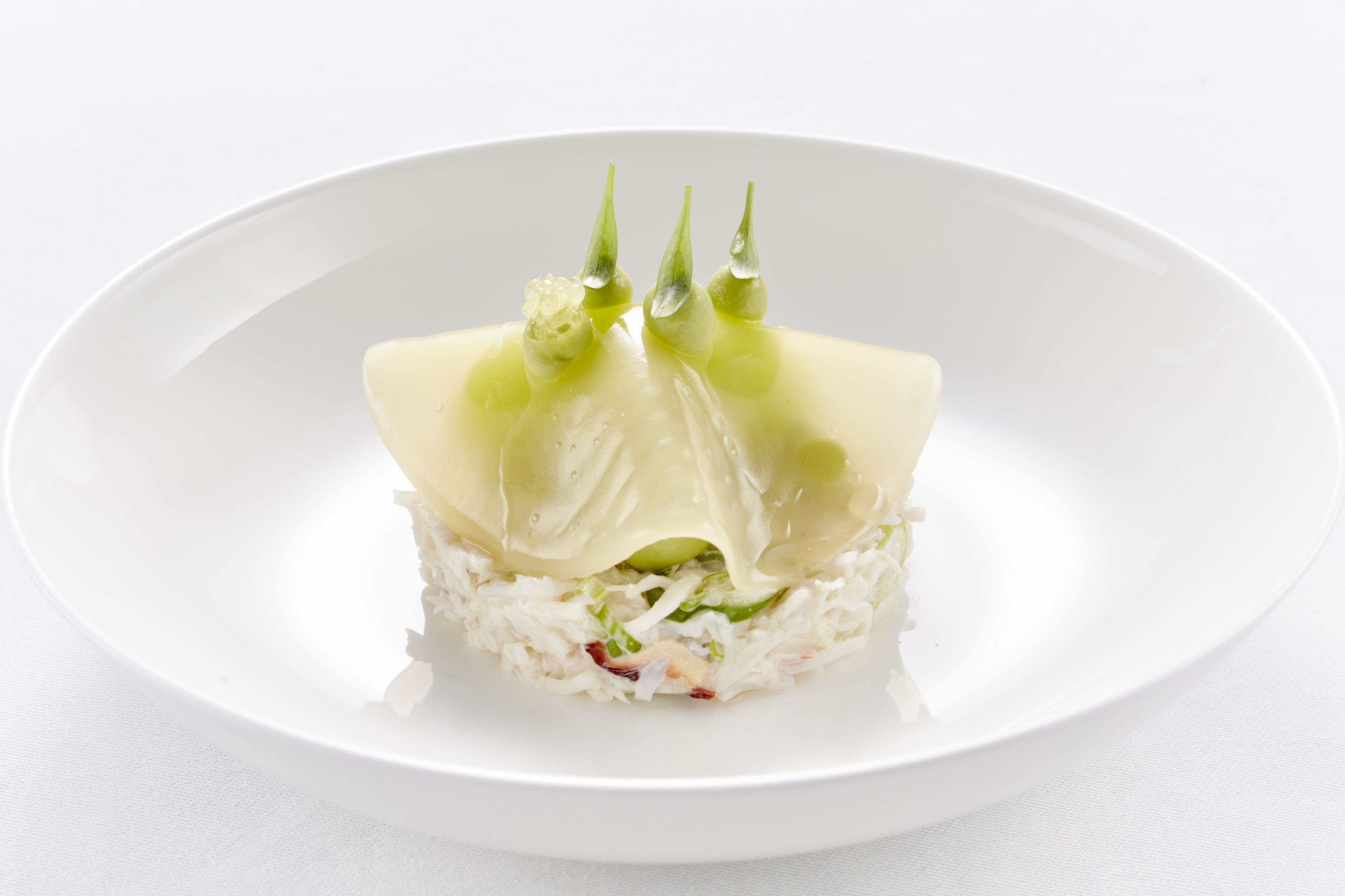 A white plate with a food dish.