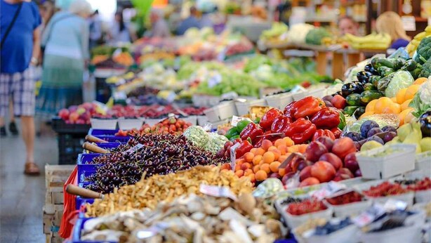 A market with various fruits and vegetables displayed in bins. - Eurostars Blue Coruña (A Coruña)