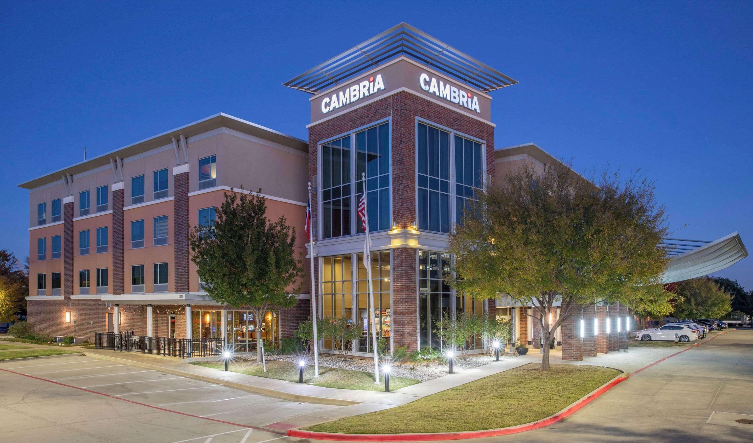 A multi-story hotel with a prominent 'Cambria' sign on the top.