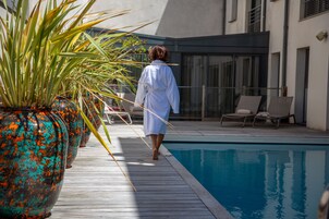 Seasonal outdoor pool, open 9:00 AM to 9:00 PM, pool umbrellas