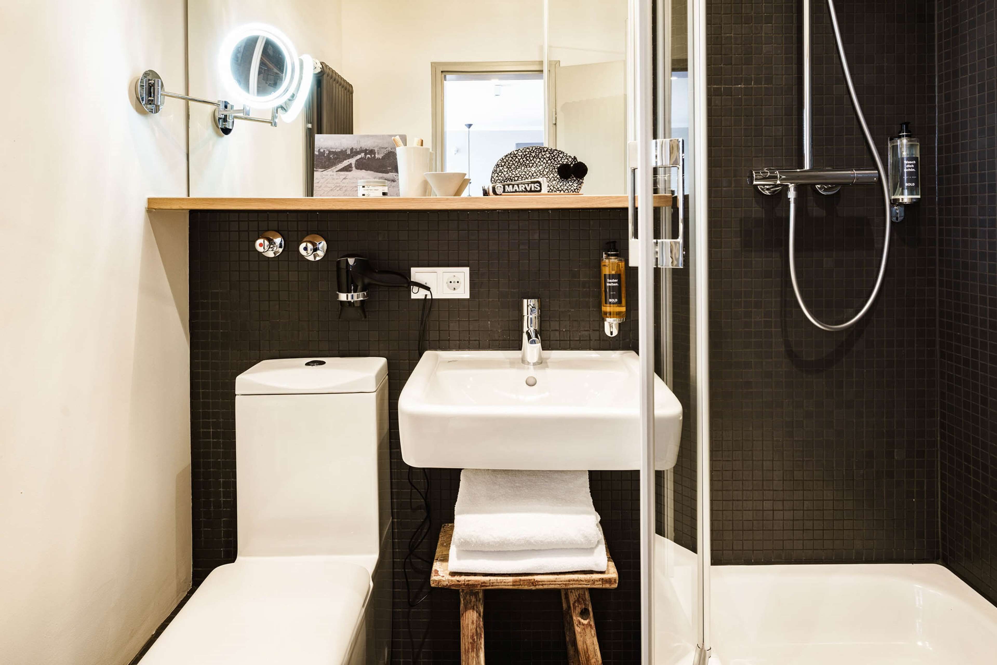 bold rooftop studio with balkony | bathroom | shower, hair dryer, towels, soap