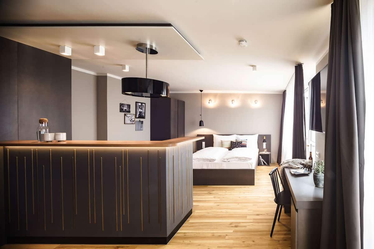 Hypo-allergenic bedding, desk, laptop workspace, blackout curtains