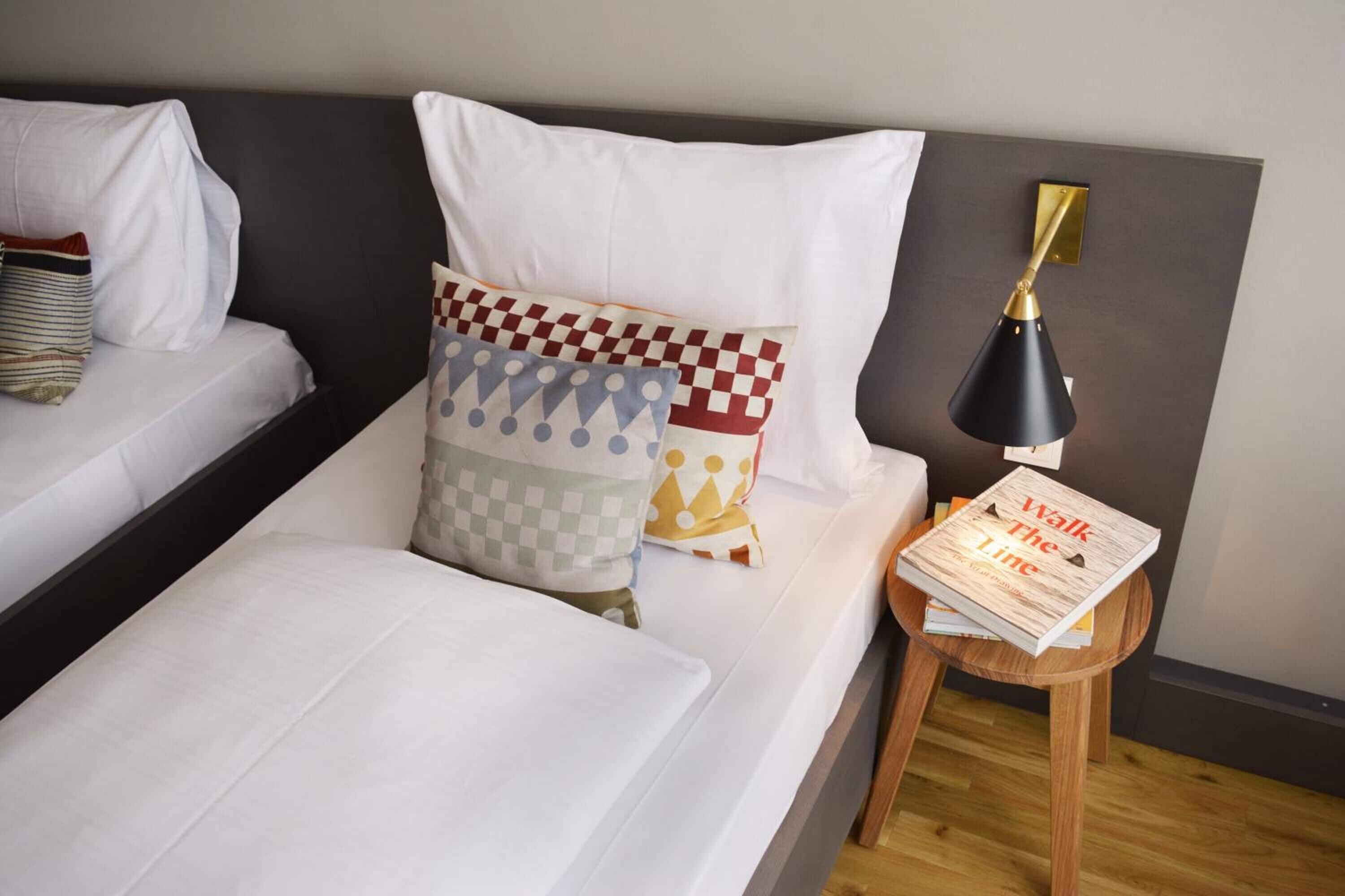 bold twin room | hypo-allergenic bedding, desk, laptop workspace, blackout curtains