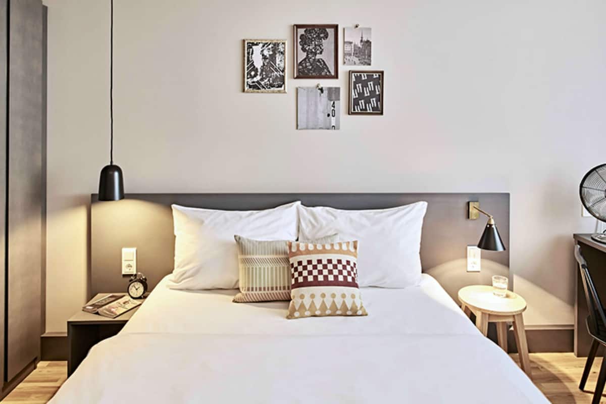 Hypo-allergenic bedding, desk, laptop workspace, blackout curtains