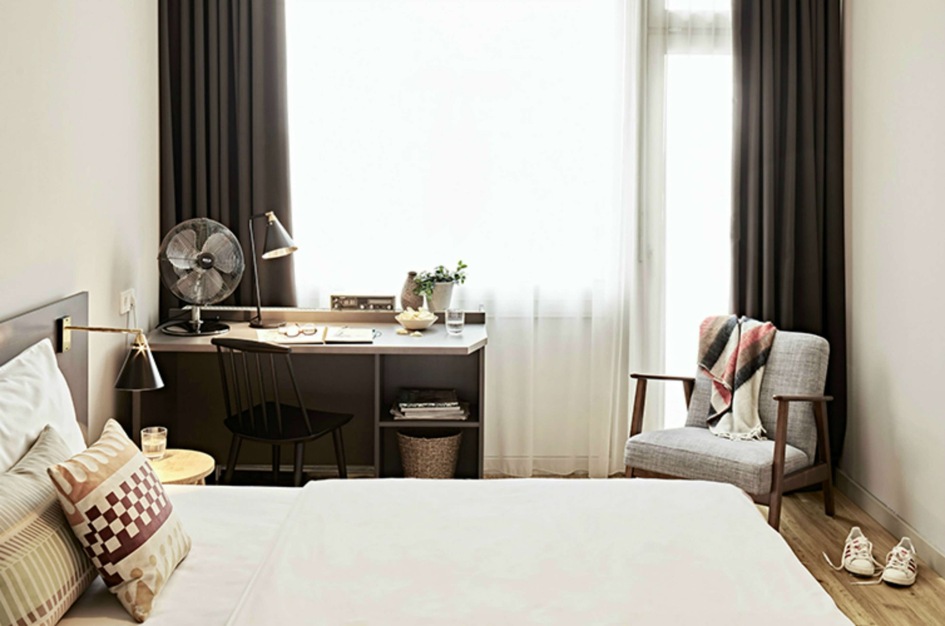 hypo-allergenic bedding, desk, laptop workspace, blackout curtains