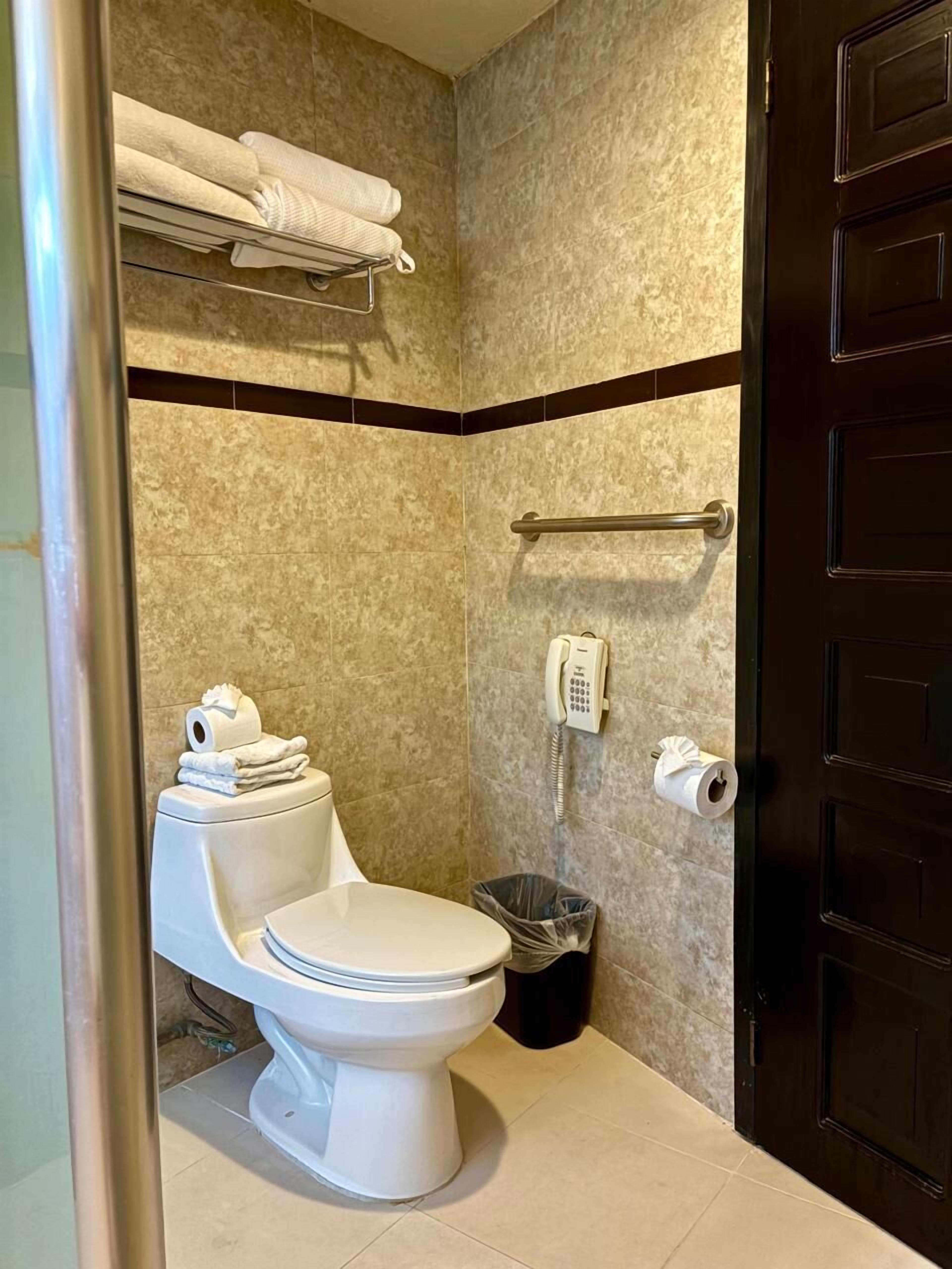 standard suite | bathroom | designer toiletries, soap, shampoo, toilet paper