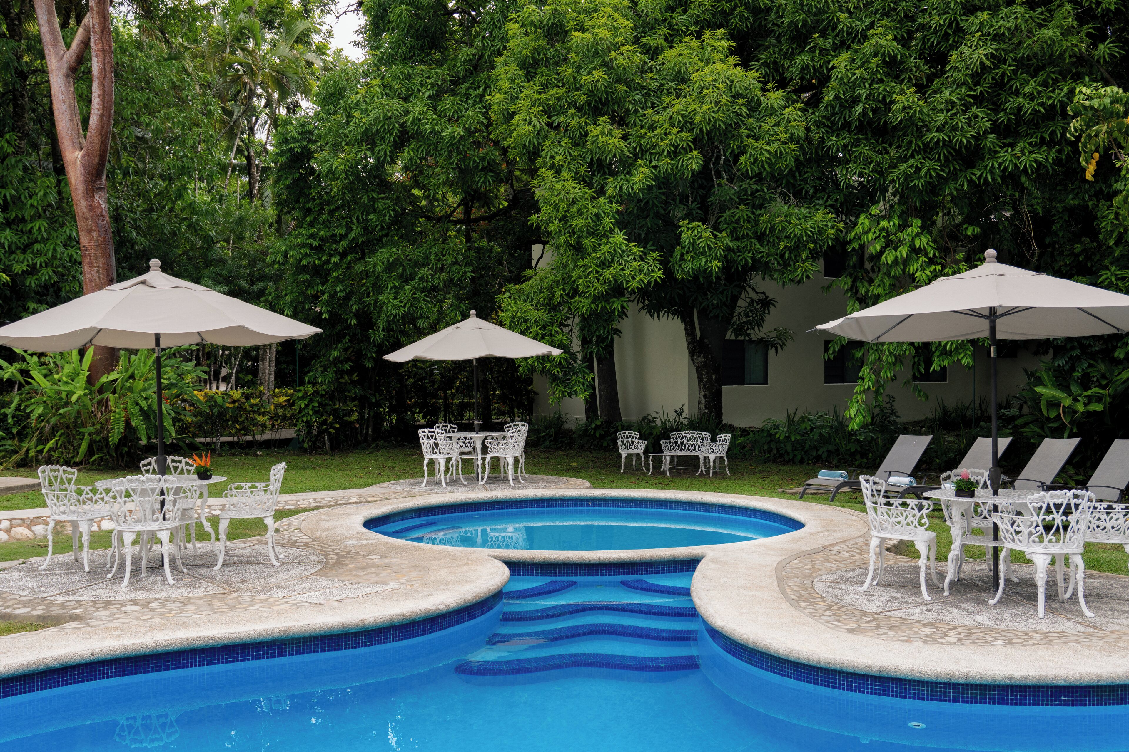 outdoor pool, open 10:00 am to 9:00 pm, pool umbrellas, pool loungers