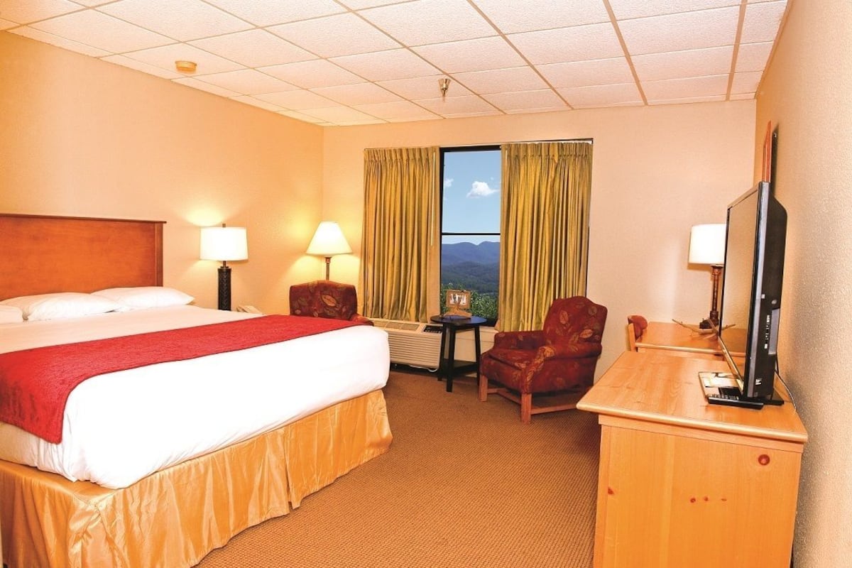 Desk, iron/ironing board, bed sheets